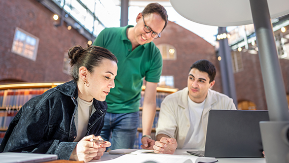 Students and teacher in the library